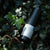Package and product shot of ReVitalize – Body Cream  lying on forest floor